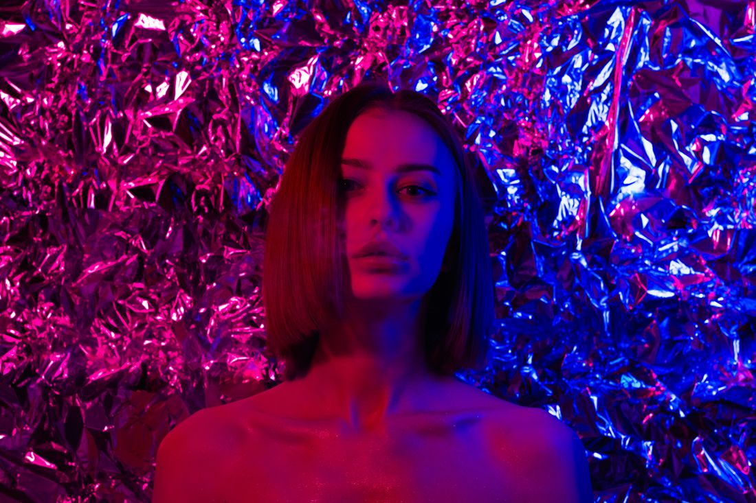 Portrait lit in red and blue gel light