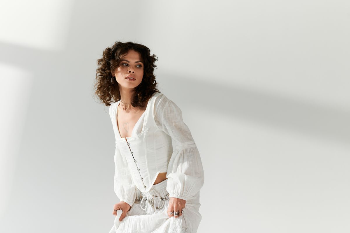 Model in a relaxed white outfit