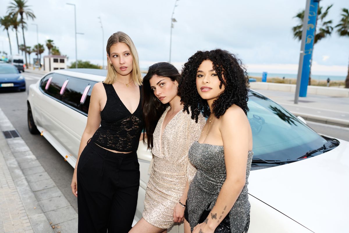 Three models in white outfits