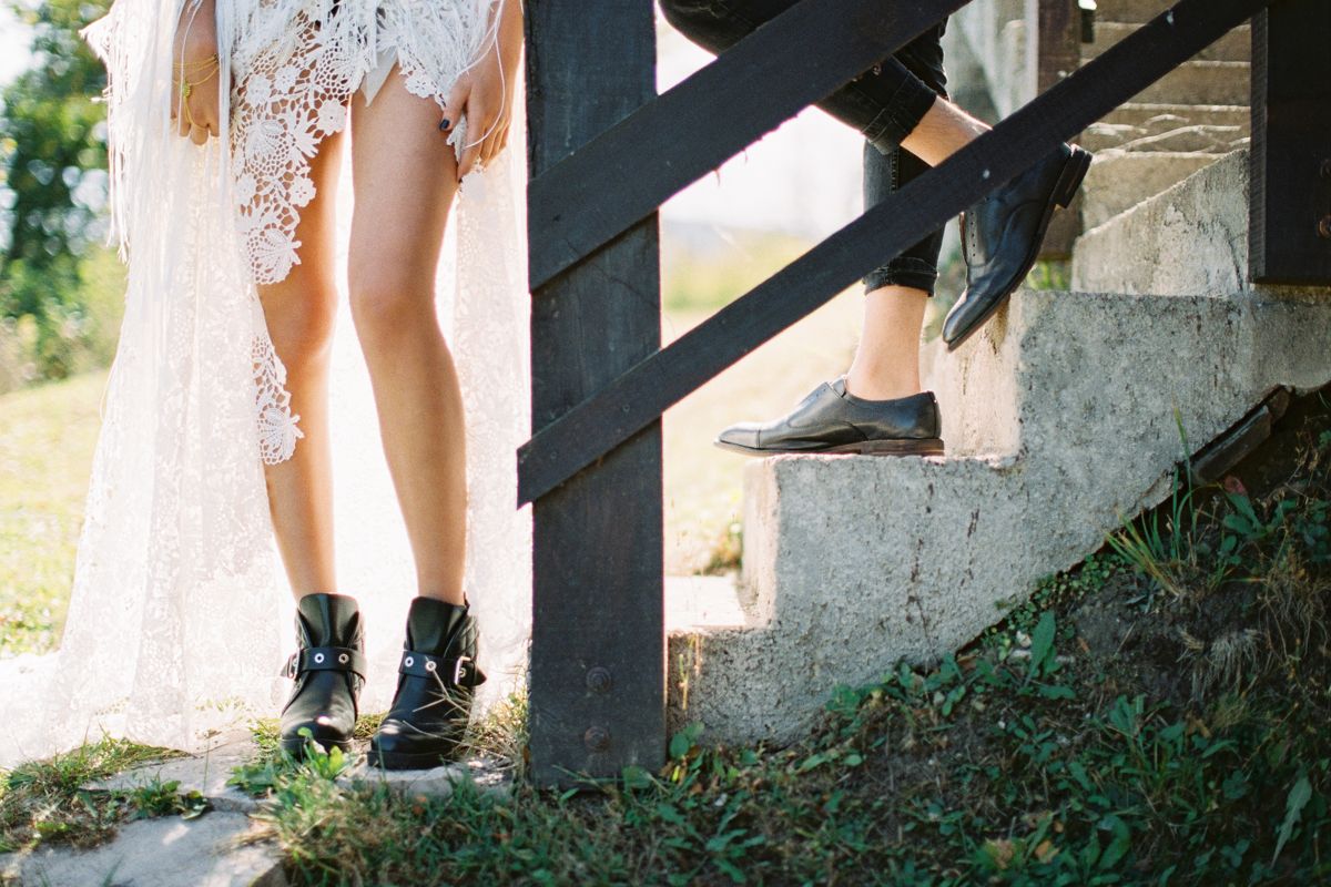 Bride and groom's shoes on historic steps — city-hall energy