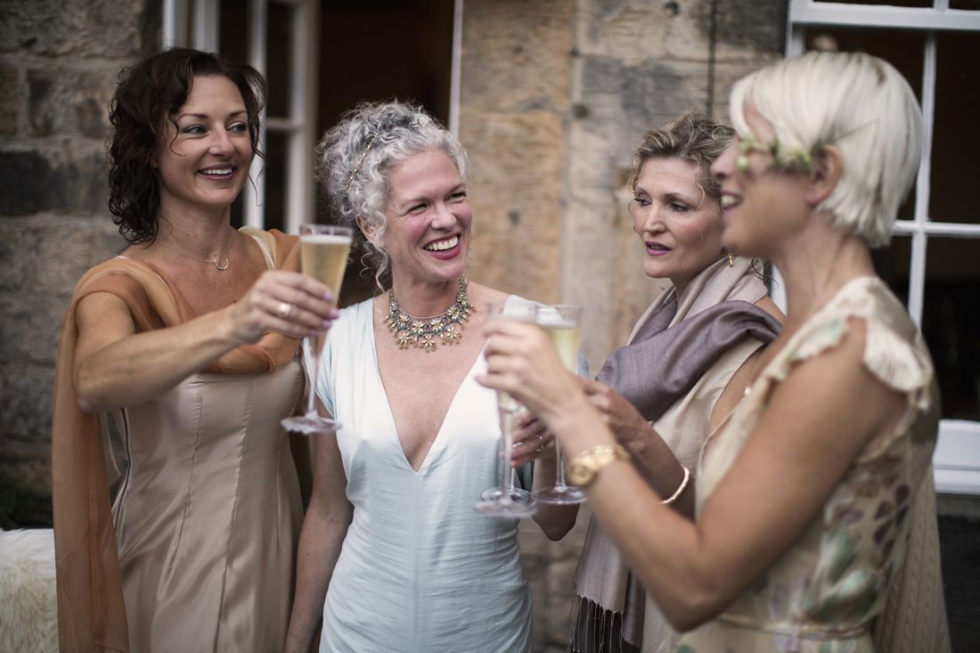Elegant women enjoying champagne in a garden