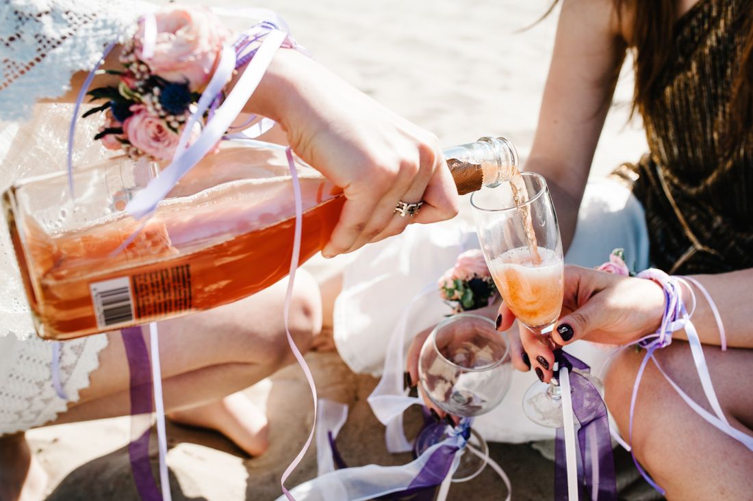 Pouring rosé at an outdoor celebration