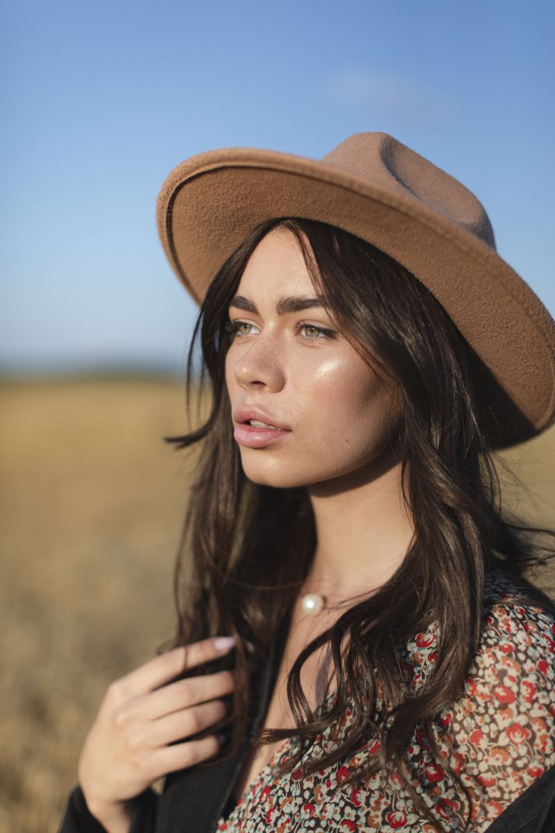 Woman standing in a wheat field
