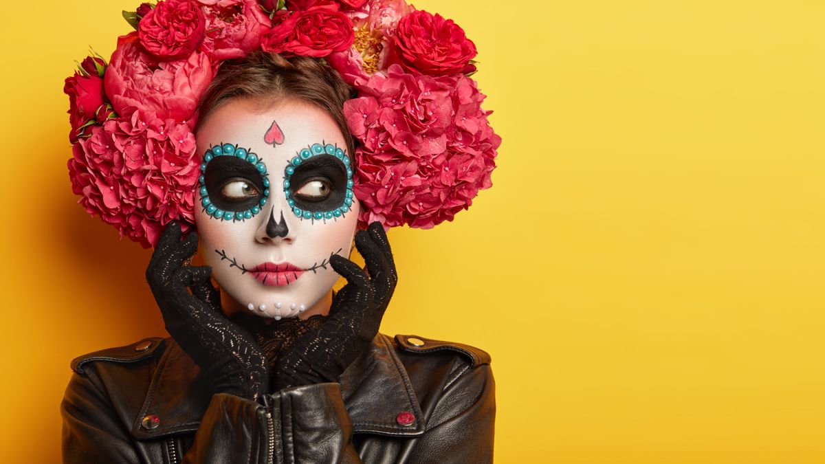 Day of the Dead makeup portrait on yellow