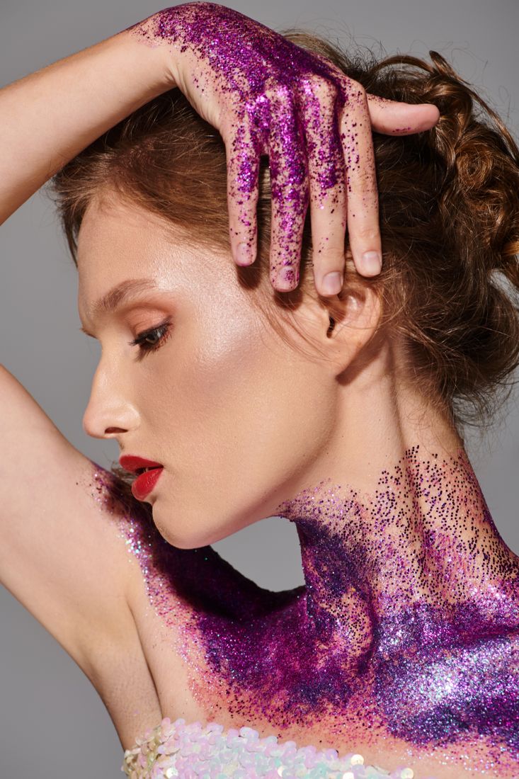Glitter adorning a model in close-up