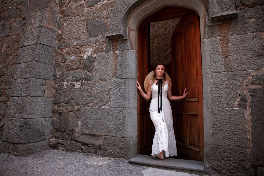 White dress in an old stone fortress doorway