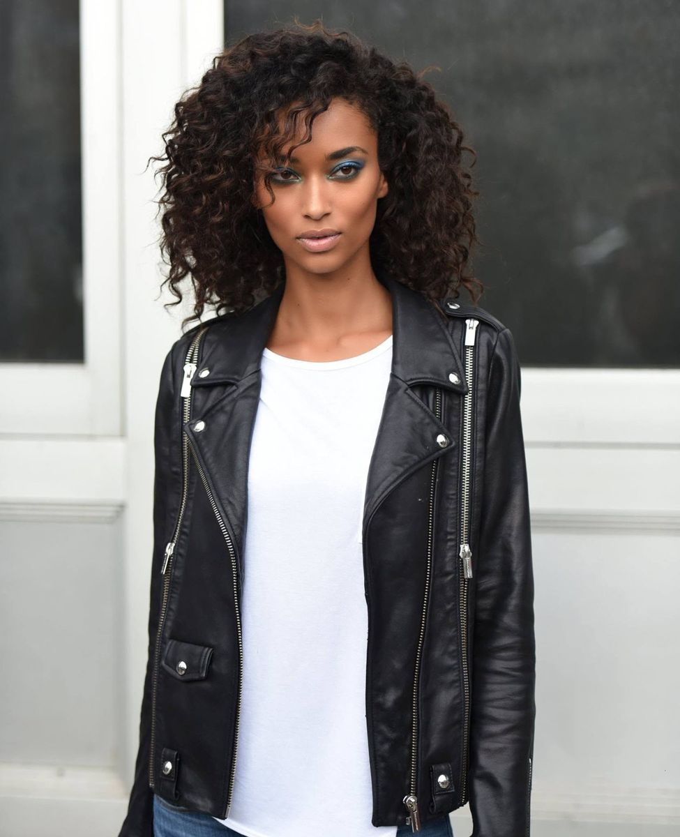 Portrait in a leather jacket over a white tee