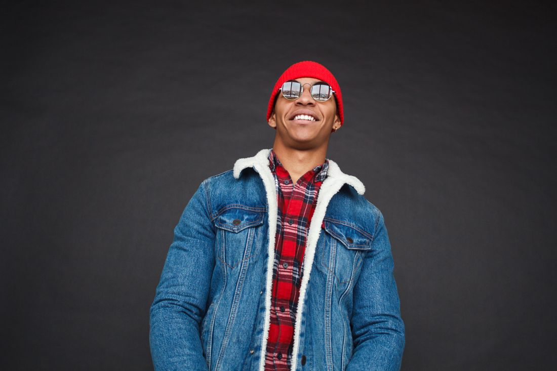 Man in denim jacket and red beanie, 90s casual