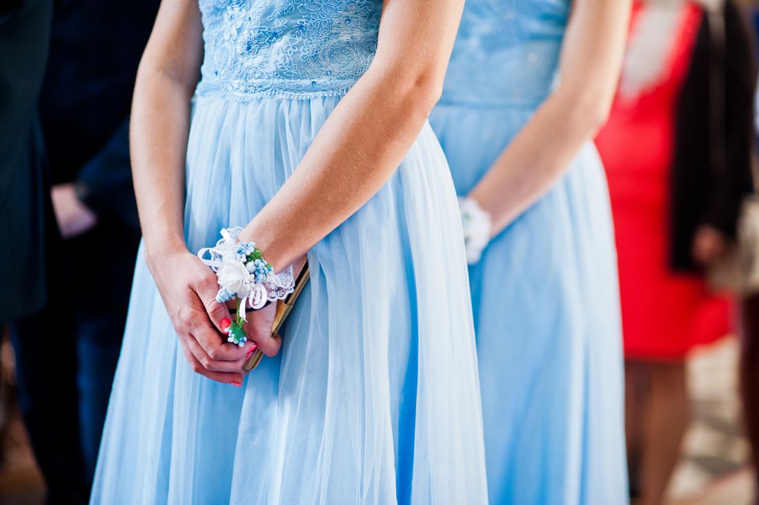 Young women in blue formal dresses