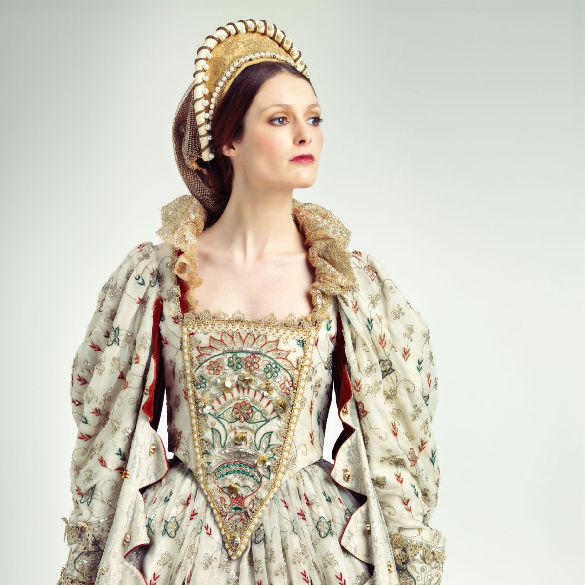 Model in a regal period gown and crown