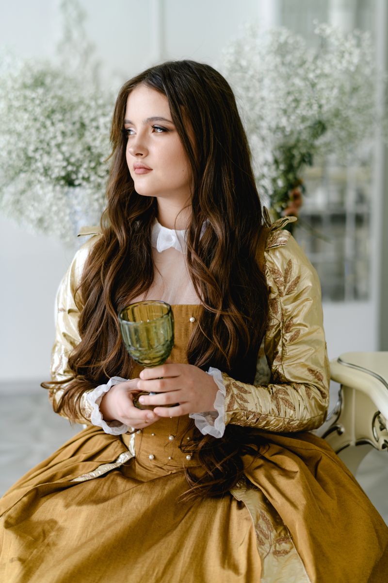 Model in a golden historical dress