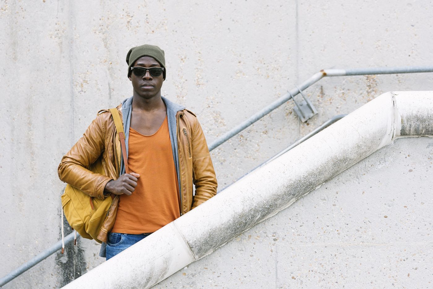 Man in casual streetwear with a bag