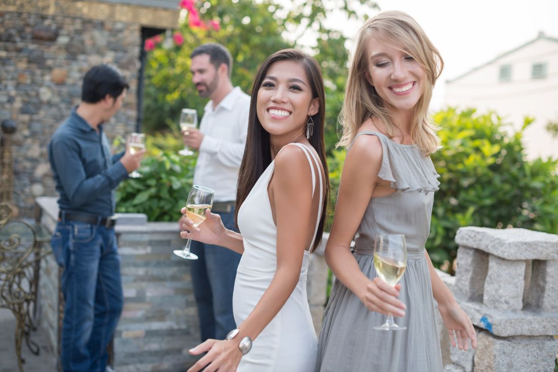 Guests enjoying drinks at a garden wedding